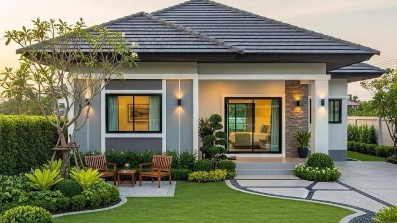 Modern house exterior with landscaped garden, green lawn, and outdoor seating area